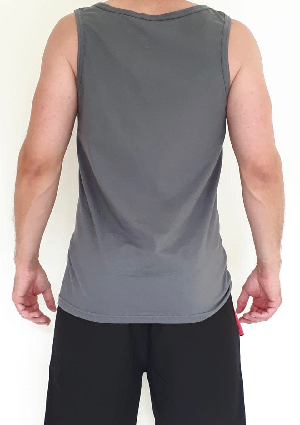 Men's charcoal vest with Solo Traveller text. View of the back